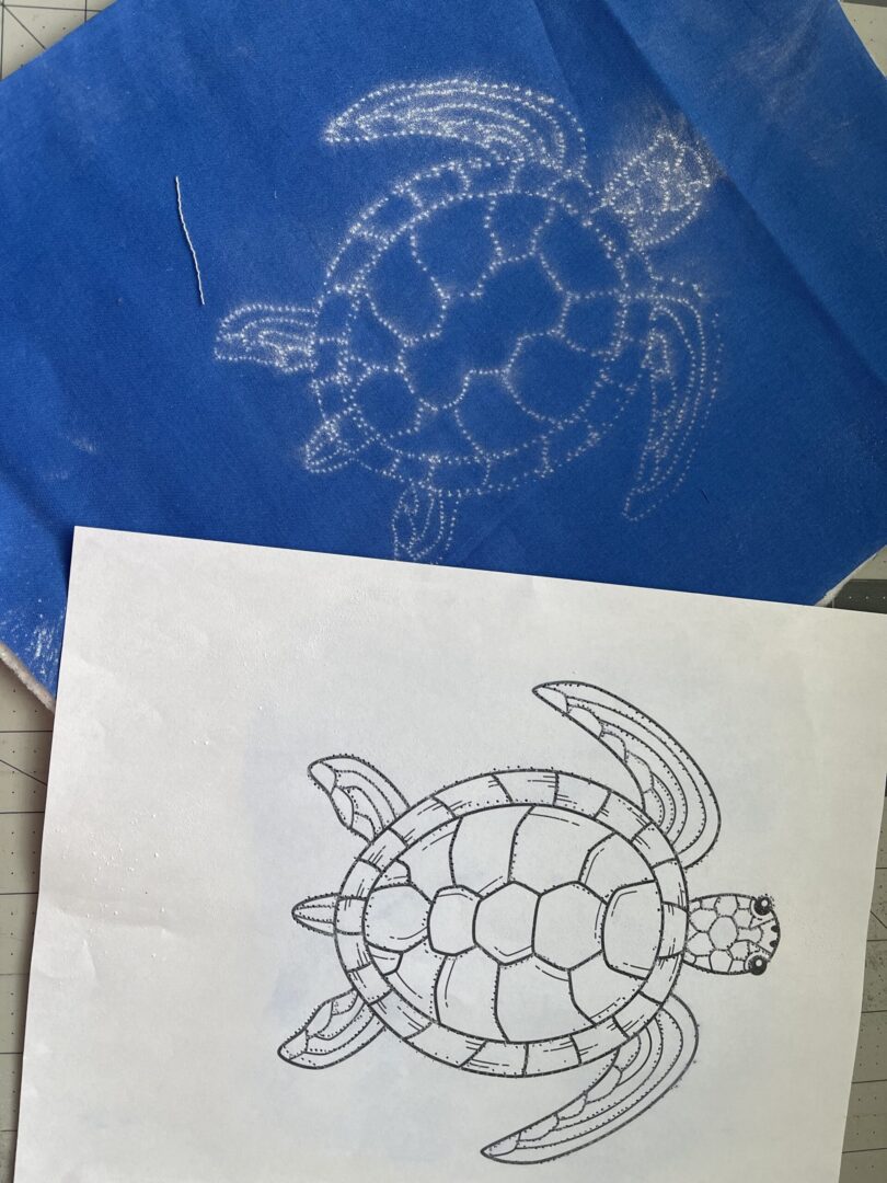 A drawing of a turtle on top of paper.