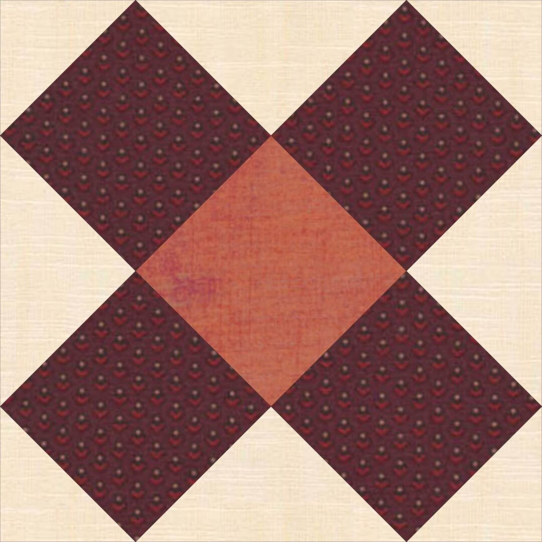 A red and white quilt block with a square in the middle.