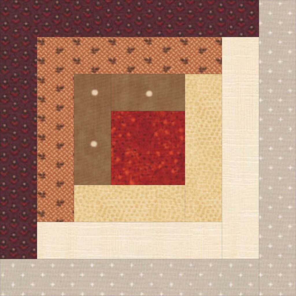 A quilt block with red, brown, and tan squares.
