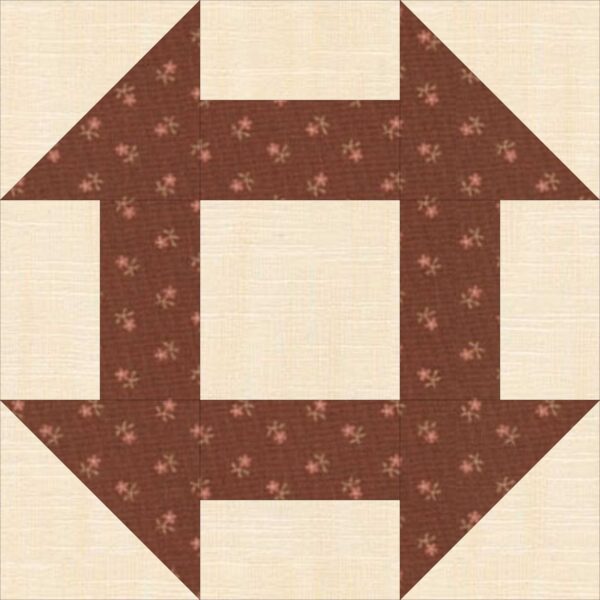 A quilt block with a brown flower design.