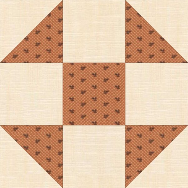 A quilt block with brown and white squares.