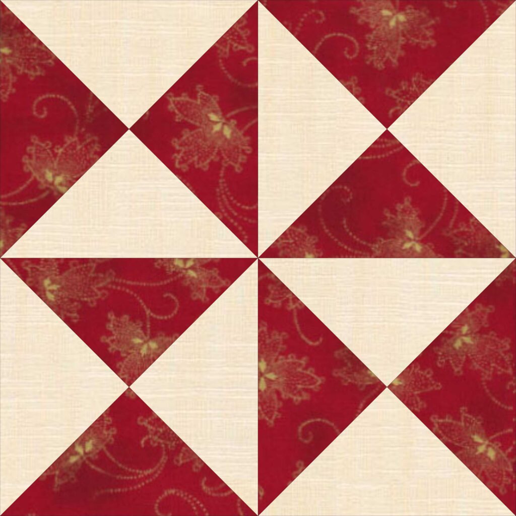 A red and white quilt block with red and white flowers.