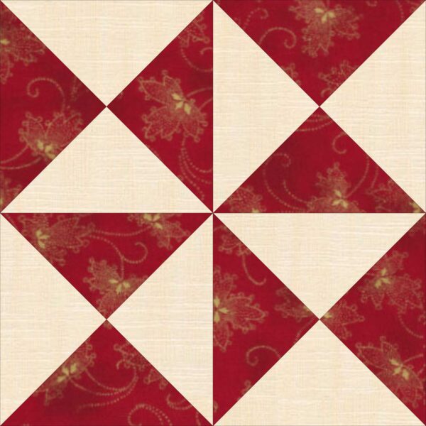 A red and white quilt block with red and white flowers.