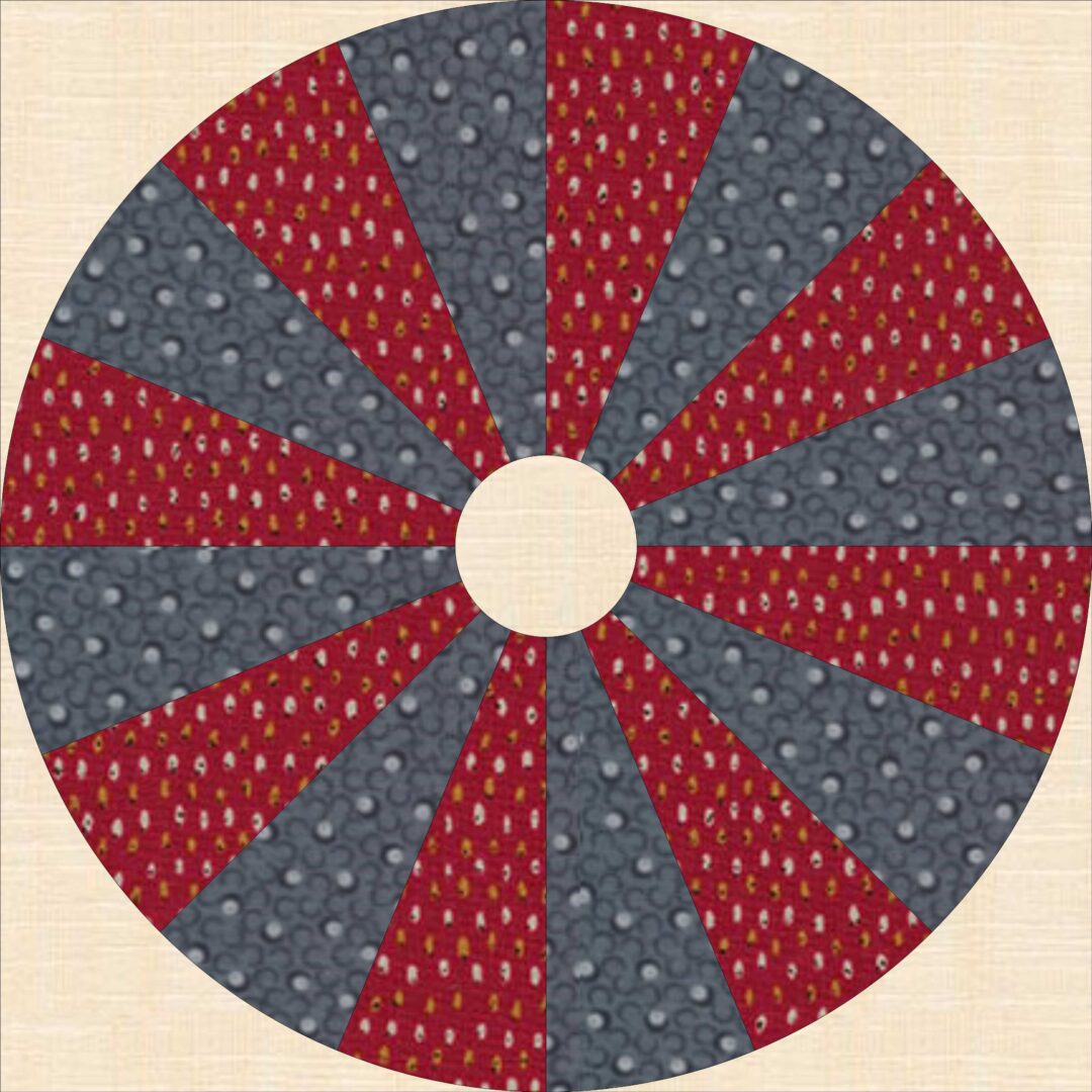 An image of a red, blue, and gray quilted circle.